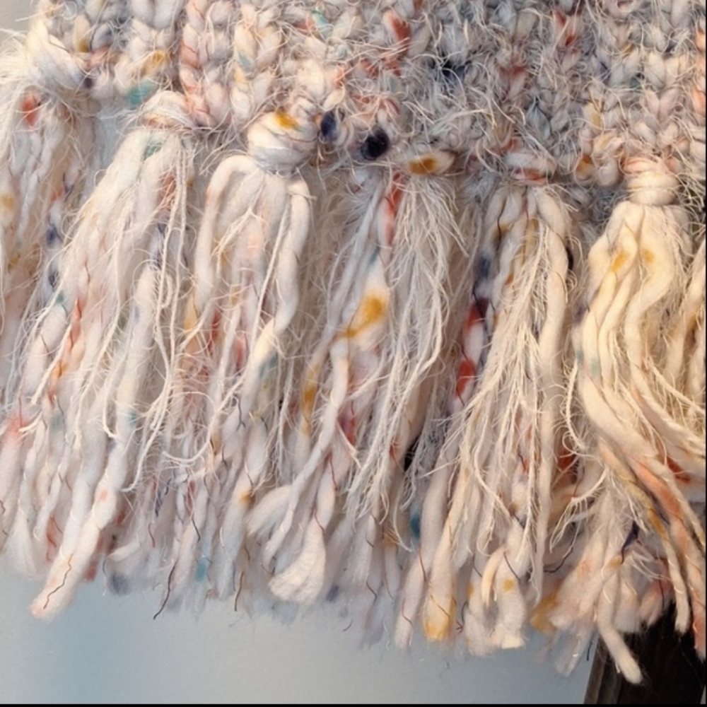 Soft crochet knit white scarf with rose gold pink accents and fluffy tassels